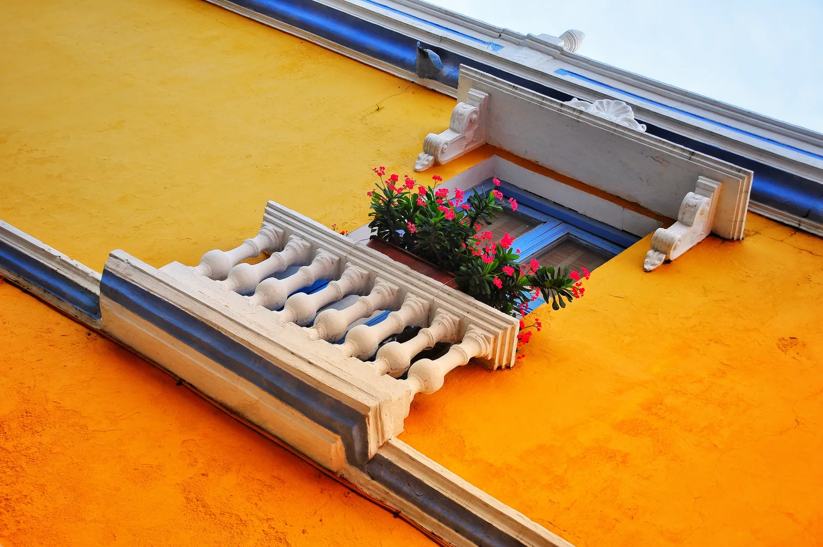 Yellow facade with white balustrade