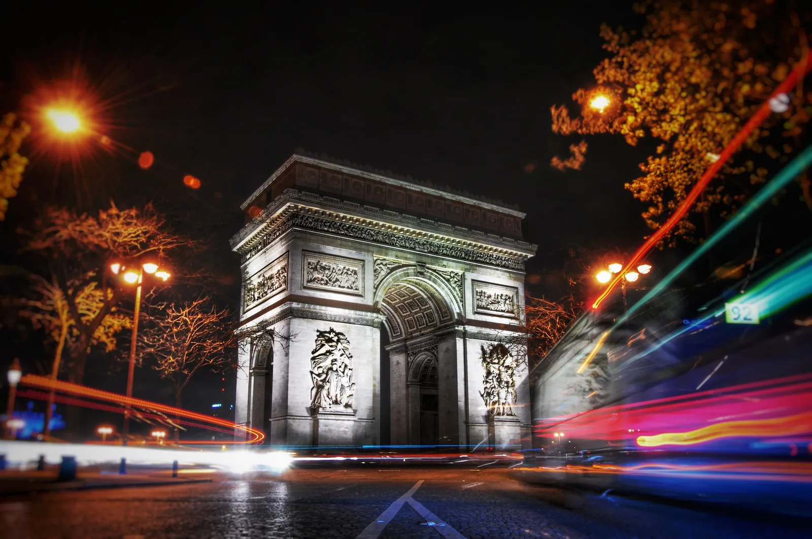 Arc de Triomphe at night with light trails